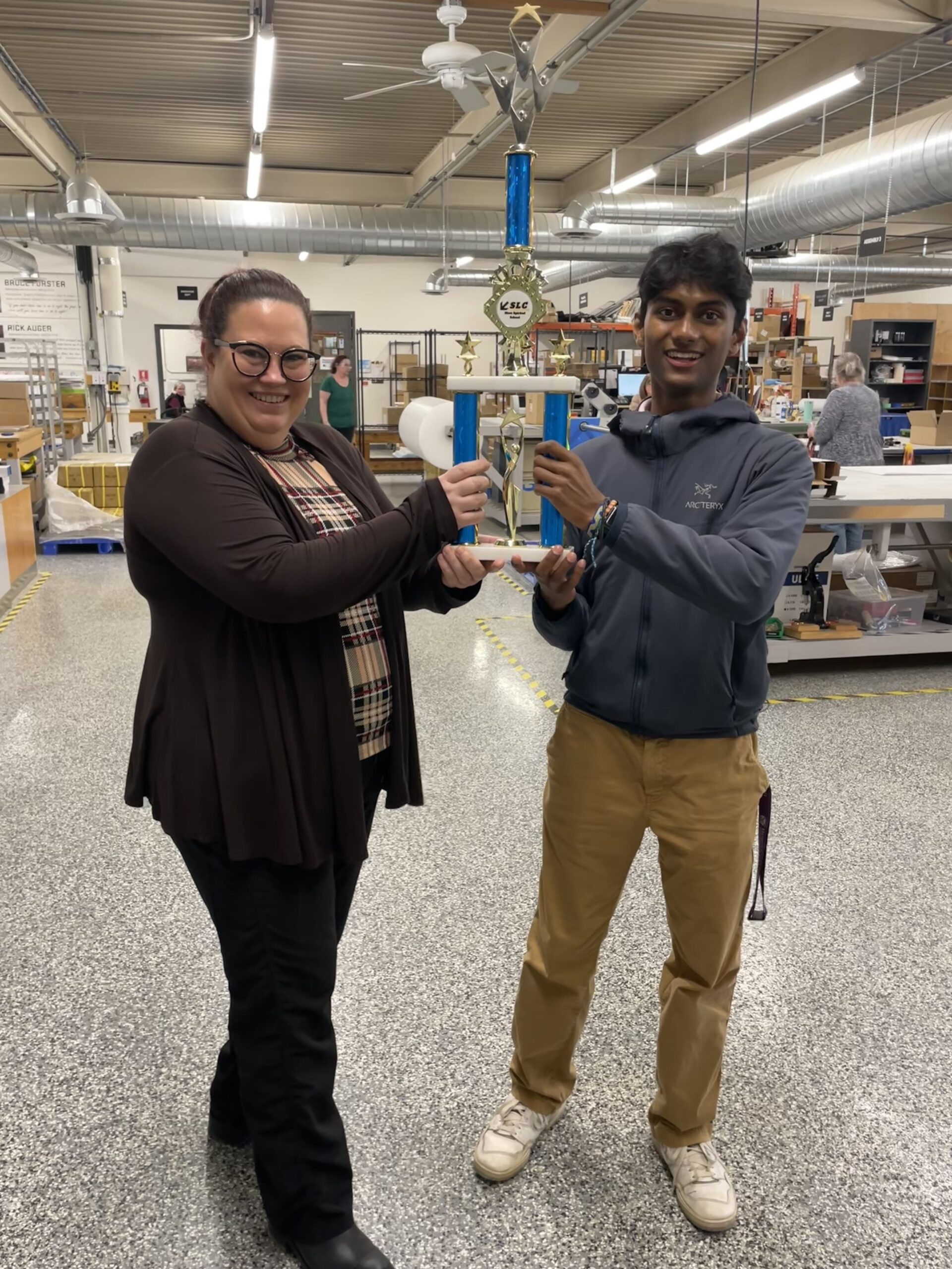 Allan receiving The Most Spirited School Trophy